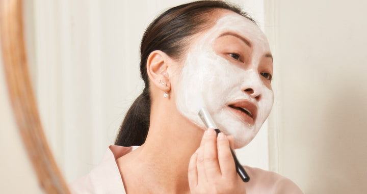 Woman applying mask