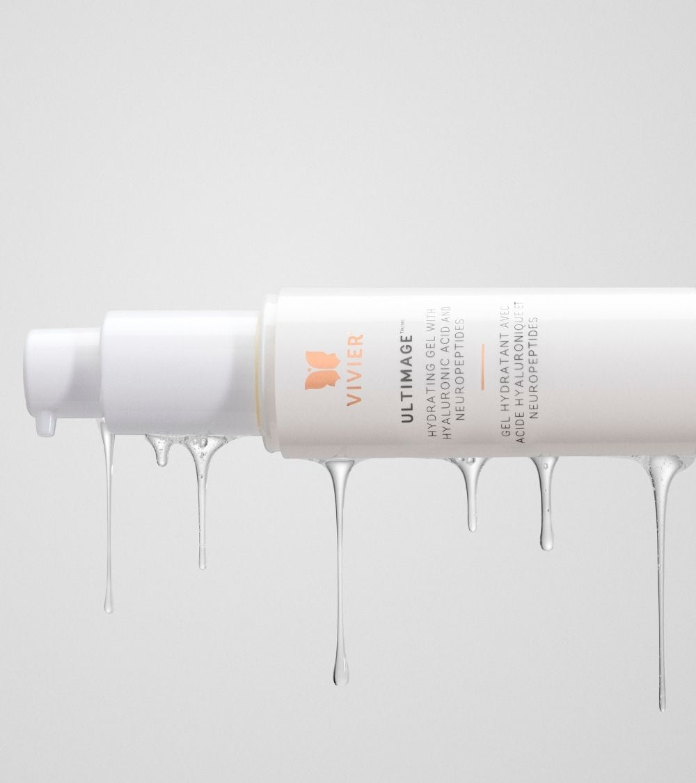 Close-up of a Vivier Ultimage cream tube with the product flowing from the opening to highlight its rich texture