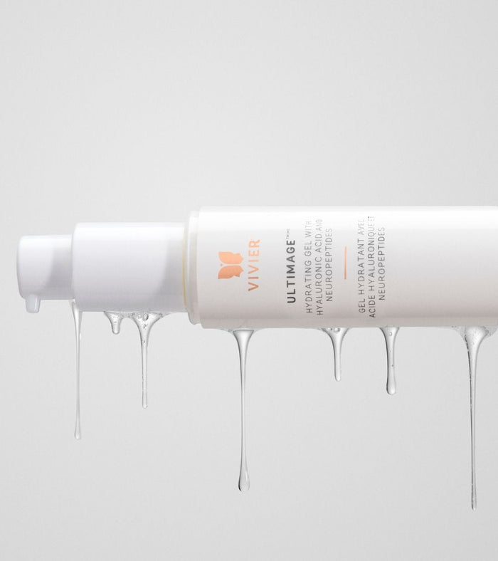 Close-up of a Vivier Ultimage cream tube with the product flowing from the opening to highlight its rich texture