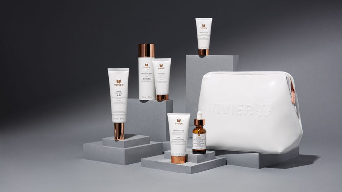 Vivier skincare collection featuring serums, treatments, sunscreen, cleanser, retinol, and a branded cosmetic bag.