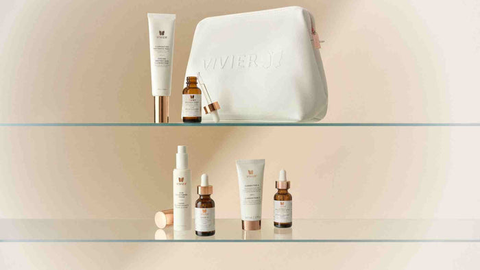 Selection of Vivier skincare products, including serums, creams, and treatments, displayed with a white Vivier cosmetic bag.