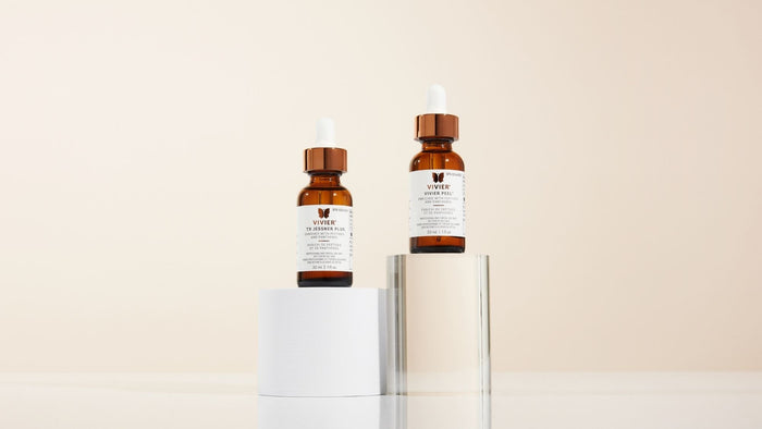 Vivier professional chemical peel solutions, TX Jessner Plus and Vivier Peel, displayed in amber glass dropper bottles.