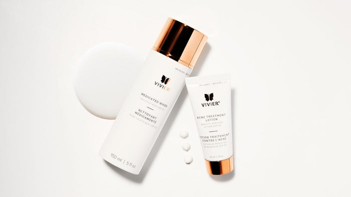 Vivier Medicated Wash and Acne Treatment Lotion arranged on a clean white background with skincare product textures.